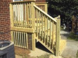 Side view (left) of back stairs built from pressure treated lumber leading to the kitchen at home on Seminary Road, Silver Spring, MD.