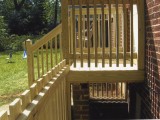 Side view (right) of exterior stairs built from pressure treated lumber leading to the kitchen at home on Seminary Road, Silver Spring, MD.