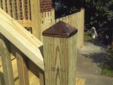 Close up of anchor post of stairs built from pressure treated lumber leading to the kitchen at home on Seminary Road, Silver Spring, MD.